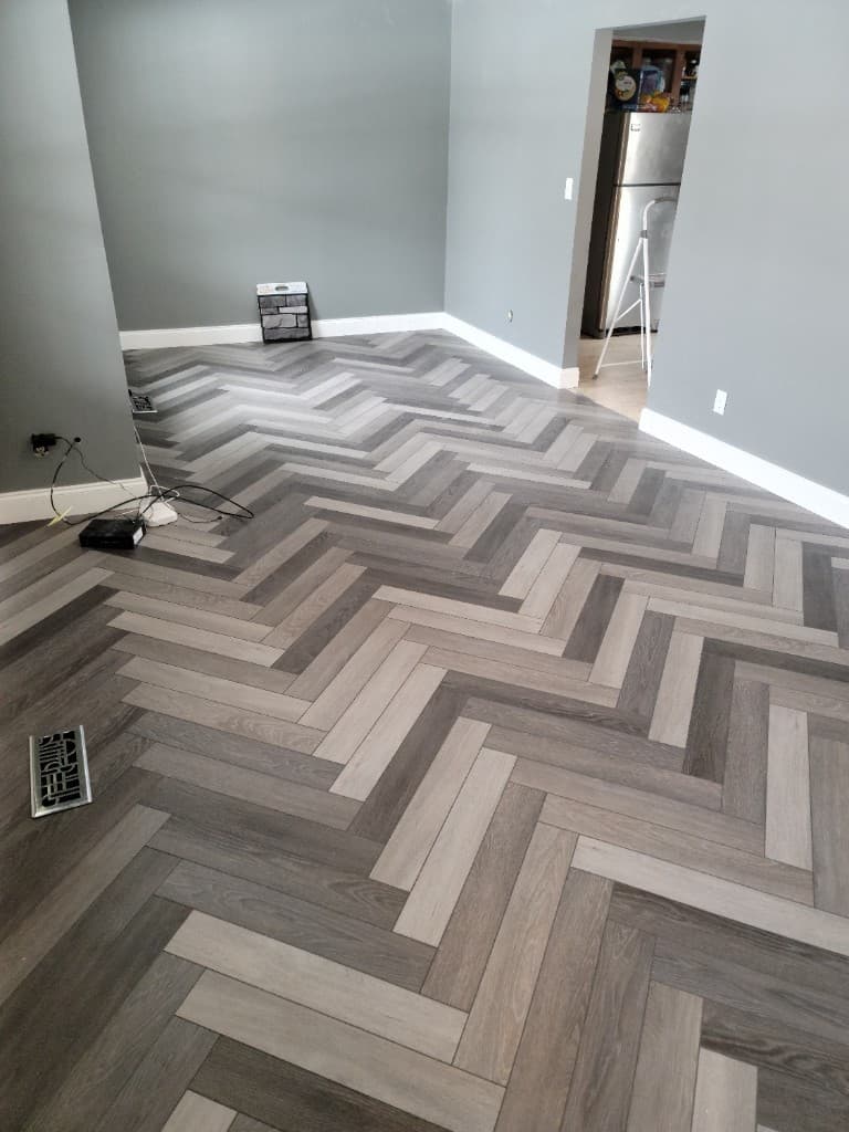 Herringbone luxury vinyl flooring installation by ABCO Builds